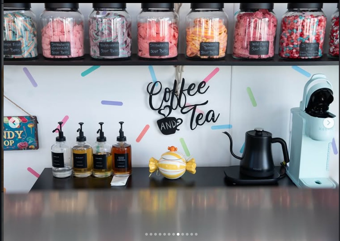Coffee and tea station with hand-lettered sign and sour belt jars